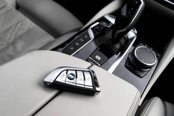 Close up of modern wireless keys of BMW 650i 2019 in white leather car interior. Modern Car interior details. Car inside — Stock Photo, Image