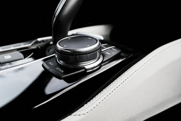 Media and navigation control buttons of a Modern car. Car interior details. White leather interior with stitching. Car detailing — Stock Photo, Image