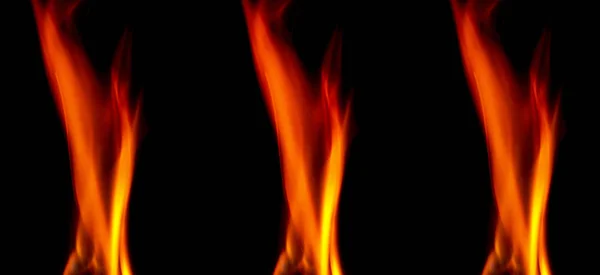Feuertextur isoliert auf schwarzem Hintergrund. Flammen auf schwarzem Hintergrund. Brandmuster. Textur der Flammen im ganzen Raum. rote Flammen aus nächster Nähe. der Hintergrund mit Feuerflammen — Stockfoto