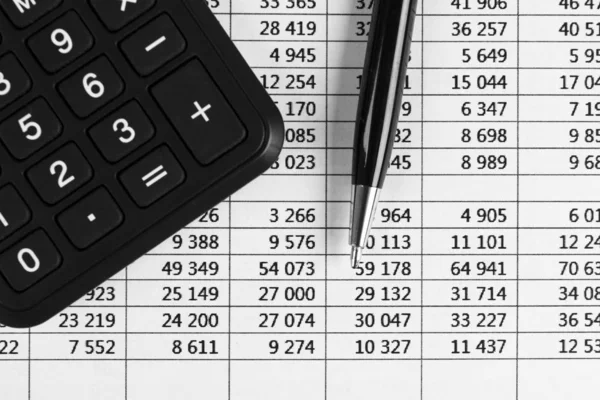 Financial concept. Calculator, pen and glasses on financial documents. Financial accounting. Balance sheets. Closeup of financial statements and annual reports. Business marketing — 스톡 사진