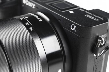 Sankt-Petersburg, Russia, February 11, 2020: Close up photo of a Sony alpha A6500 4k Mirrorless SLR camera with camera lens. 
