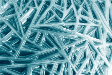 Buz yüzeyinin dokusu. Buz ve kar dokusu arka planı. Soyut çizilmiş buz yüzeyi. Donmuş su kış arka planı.