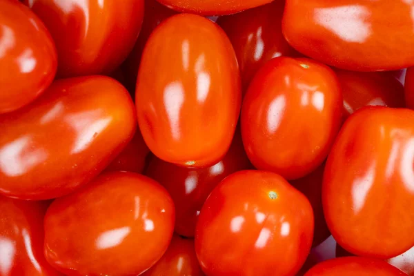 Background of cherry tomato. Top view. Fresh cherry tomatoes. Tomato background