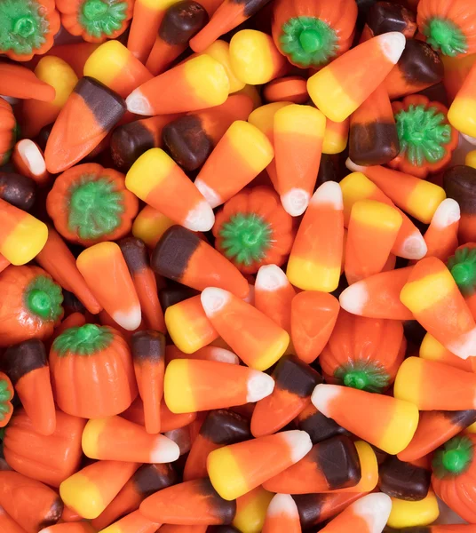 Filled frame of autumn holiday candy corn and pumpkin shapes — ストック写真