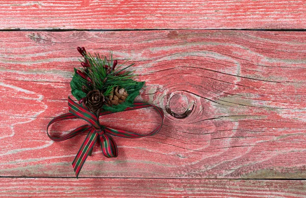 Holiday ribbon on rustic red wooden boards — Stock Photo, Image