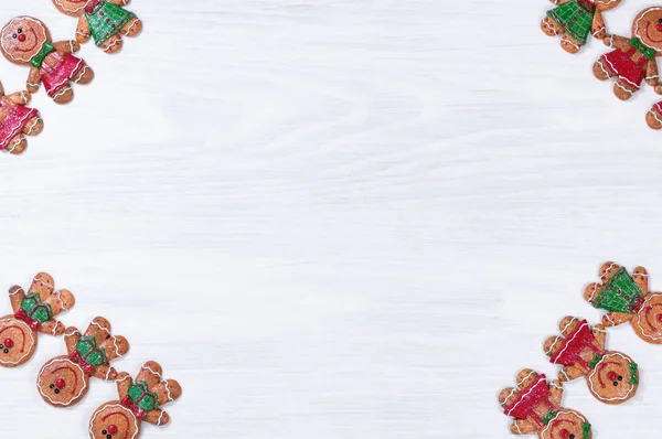 Tavole di legno bianco con biscotti di Natale su tutti gli angoli — Foto Stock