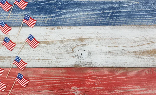 Mini USA flags on rustic wooden boards painted in national color — Stock Photo, Image