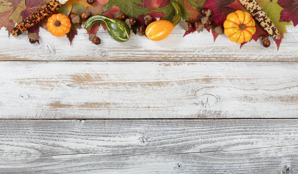 Top border of Autumn foliage with other fall decorations on whit — Stock Photo, Image