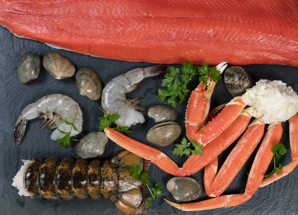 Freshly prepared seafood on natural slate rock — Stock Photo, Image
