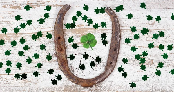 St Patrick Day lucky items on rustic white wood — Stock Photo, Image