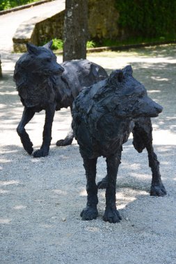 Statues of wolfs near Neuchatel church in Switzerland clipart