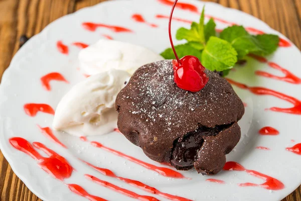 chocolate lava cake set with ice cream and strawberry