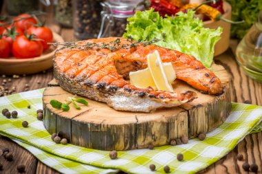 grilled salmon steak on a plate made clipart