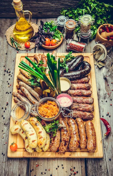 A set of different sausages, grilled on plate — Stock Photo, Image
