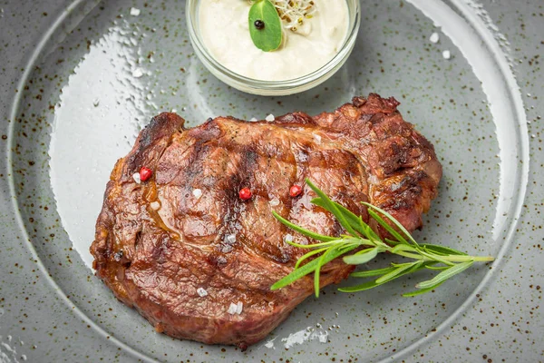 Tenderloin steak on plate with sauce — Stock Photo, Image