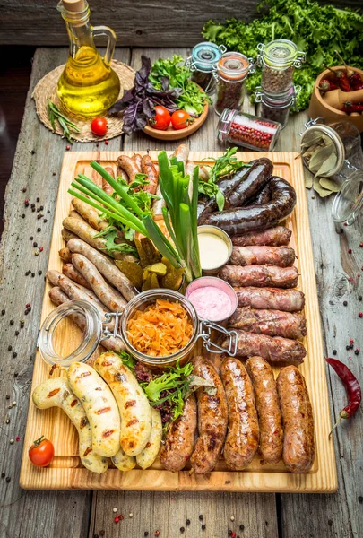 A set of different sausages, grilled on plate — Stock Photo, Image