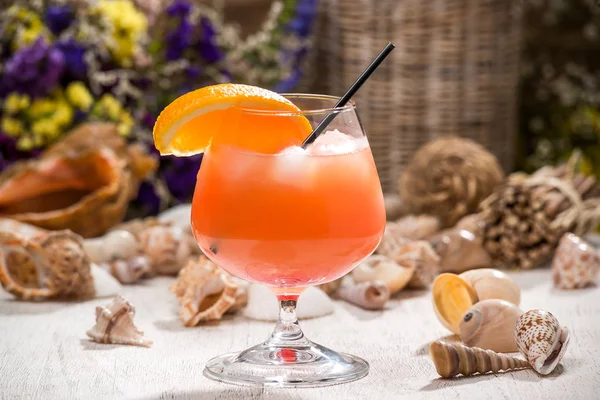 beautiful alcoholic cocktail, on a wooden table, in a beautiful glass