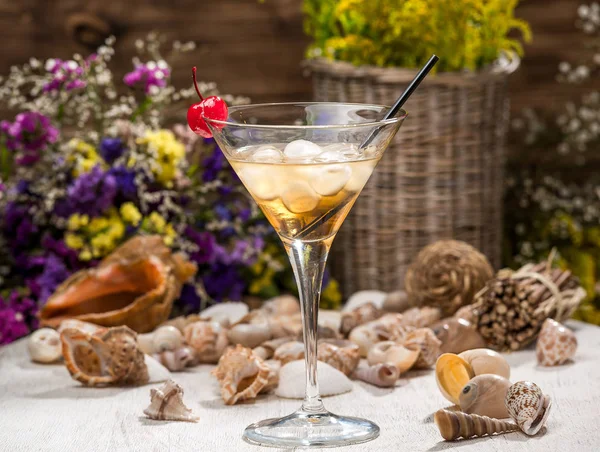 beautiful alcoholic cocktail, on a wooden table, in a beautiful glass