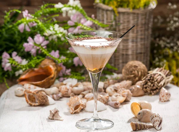 beautiful alcoholic cocktail, on a wooden table, in a beautiful glass