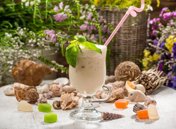 beautiful alcoholic cocktail, on a wooden table, in a beautiful glass