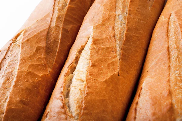 Baguete francesa, pão. Isolado sobre fundo branco — Fotografia de Stock