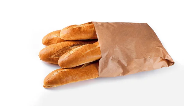 Pain baguette en sac de papier sur fond blanc — Photo