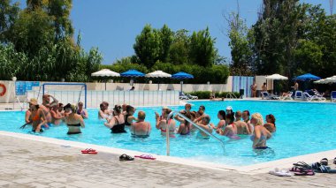 AFANDOU VILLAGE, RHODES, GREECE - JULY 26, 2019: Water aerobics class at Dessole Lippia Golf Resort Hotel