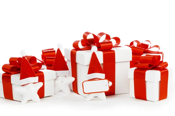 White gift boxes with red ribbons — Stock Photo, Image