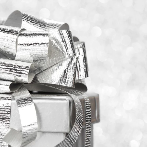 Decorative holiday Gift box and ribbon on bright shiny background — Stock Photo, Image