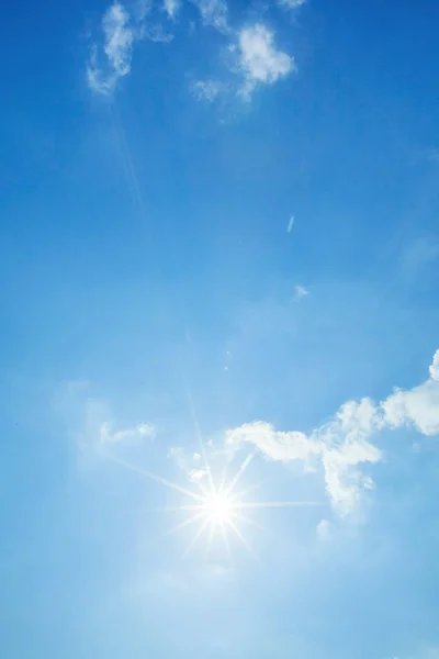 Blue sky with clouds and sun — Stock Photo, Image