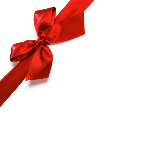 Red satin bow ribbon on white — Stock Photo, Image