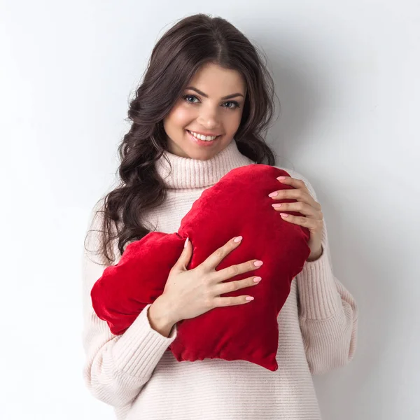Woman with pillow heart — Stock Photo, Image