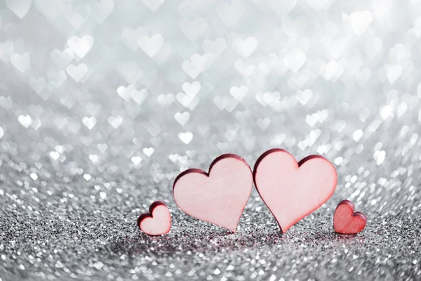 Four hearts on glitters — Stock Photo, Image