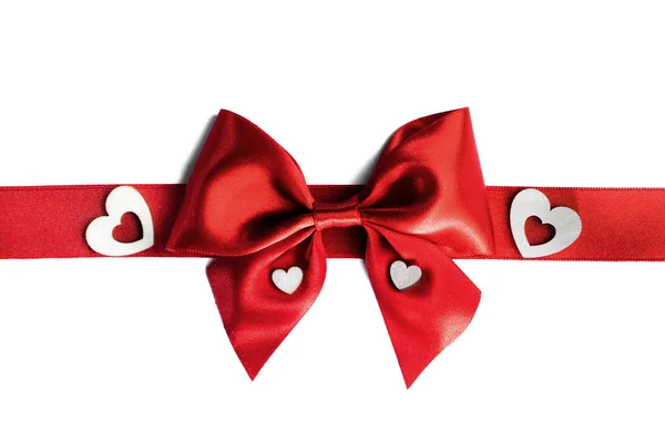 Red gift bow and hearts — Stock Photo, Image