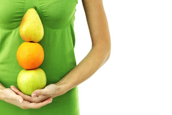 Pilha de frutas em mãos de mulher em branco — Fotografia de Stock