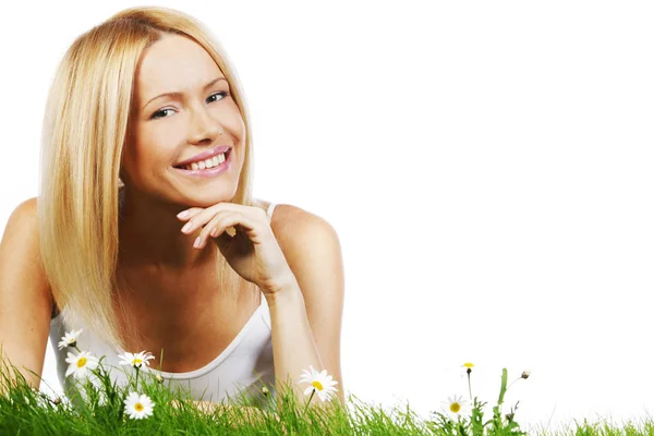 Woman on grass with flowers Royalty Free Stock Photos