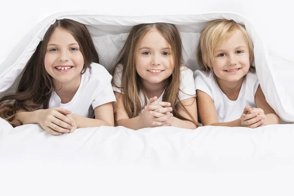 Children under blanket — Stock Photo, Image