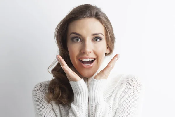 Surprised woman in sweater — Stock Photo, Image