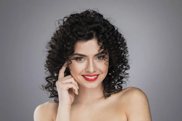 Beautiful woman with curly hair — Stock Photo, Image