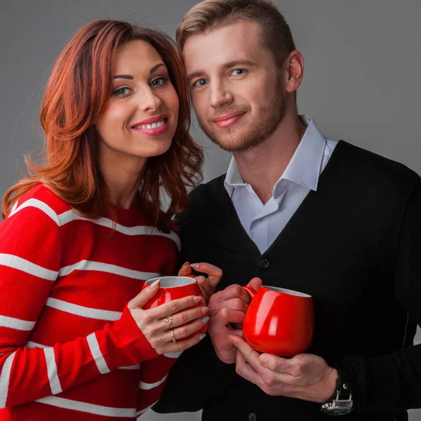 Couple with cups — Stock Photo, Image