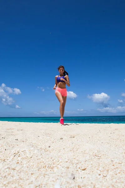 Running woman on beach — Stock Photo, Image