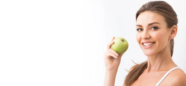 Woman with holding green apple — Stock Photo, Image