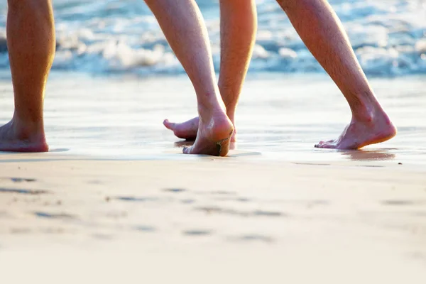 People walking on beach — Stock Photo, Image