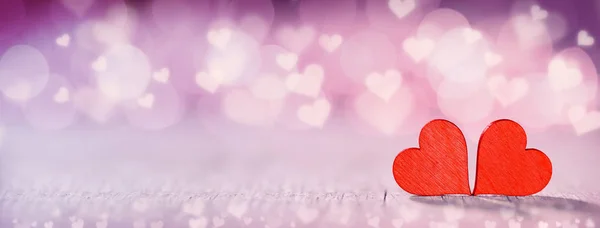 Two red hearts on bokeh background — Stock Photo, Image