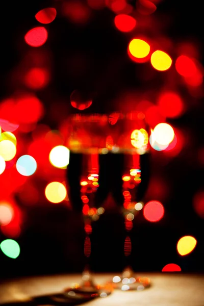 Flöjter av champagne bokeh ljus — Stockfoto