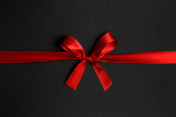 Red bow on black — Stock Photo, Image