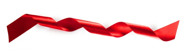 Red ribbon tape isolated on white — ストック写真