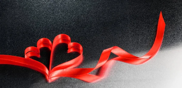 Red ribbon hearts on metal — 스톡 사진