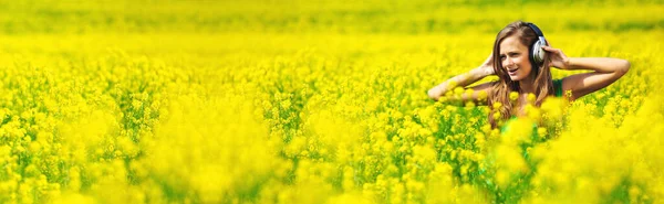 Young Woman Headphones Listening Music Oilseed Flower Field — Stock Photo, Image