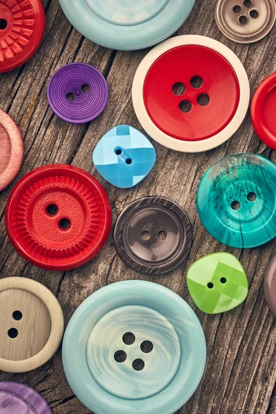 Colorful buttons on wood — Stock Photo, Image